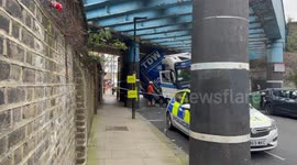Large truck gets stuck under a bridge in Camden, north London