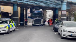 Large truck gets removed from bridge in Camden, north London