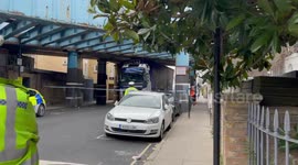 Large truck gets removed from bridge in Camden, north London