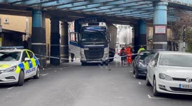 'Damaged' truck freed after becoming stuck underneath railway bridge in Camden, London