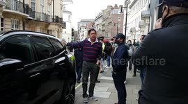 Myanmar's ambassador to UK waits on pavement after being locked out of embassy in 'mini coup'