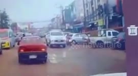Motorcycle rider saved by helmet after falling under wheels of pickup truck