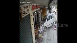 CCTV captures terrifying moment Indian street vendor dodges out-of-control car