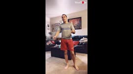 'Man Tries to Sit Down without Bending Knees and Using Hands'