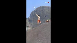 Daredevil snatches leaf out of friend's hand while travelling at 130 mph in wingsuit