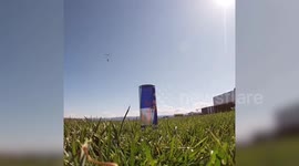 Skydiver amazingly snatches can of Red Bull as he lands