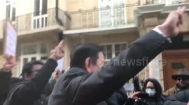 Myanmar's ambassador to UK makes three-finger salute outside London embassy