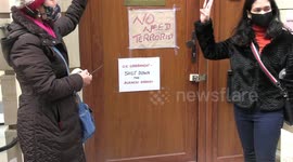 Posters stuck to Myanmar embassy door