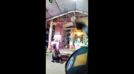 Woman spins plates on iron bar in Vietnam