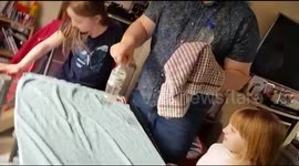 Dad shows kids a