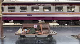 Homeless people sleeping at Bangkok train station
