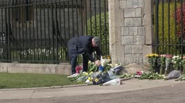 'I loved his tenacity': Mourners gather at Windsor Castle with flowers following the death of Prince Philip
