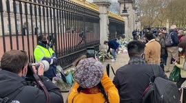 A large crowd is gathering outside Buckingham Palace to mourn Prince Philip