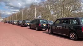 Black cabs line up on the Mall near Buckingham Place to pay tribute to Prince Philip
