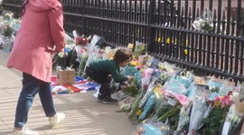 Prince Philip: Child lays flowers at gates of Buckingham Palace