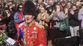 'Lifelong supporter' of royal family in Guards uniform lays wreath at gates of Buckingham Palace
