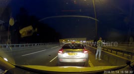 He's taking the p***! Driver blocks traffic on UK highway to relieve himself