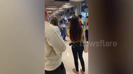 Furious passenger yells at check-in staff following five-hour flight delay