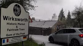 It's not hail, and it's not snow... it's called graupel. Flash graupel, hailstones & snow shower in Wirksworth in the Derbyshire Dales UK Weather