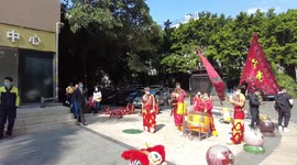 Chinese lion dance team playing drums and gongs to celebrate the Chinese New Year in 2021