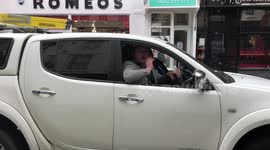 Man in a car shouts support for Piers Corbyn in Richmond, London