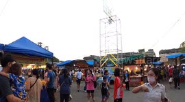 Walk around this lively fairground carnival in Thailand