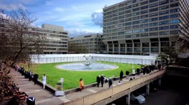 timelapse of Londoners queuing in the Spring sunshine for Covid vaccines at St. Thomas' Hospital