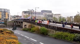Protersters march in downtown Rennes, France in defense of natural area