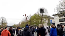 Protesters bring forks during demonstration in defense of local natural area in Rennes, France