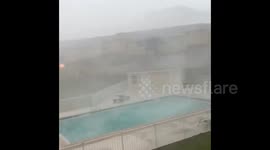 Hail, heavy rain and strong winds batter Pensacola, Florida