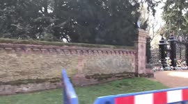 More people gather to lay flowers at the gates of the Royal Sandringham Estate after the death of Prince Philip