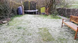 Cup of tea in the garden interrupted by freak snow shower after lots of sunshine