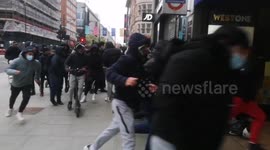 Eager shoppers rush into JD Sports in London as lockdown rules eased in England