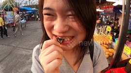 Eating insects at a Bangkok market