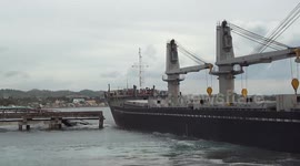 Engine failure sees huge cargo ship crash through docks in the Philippines