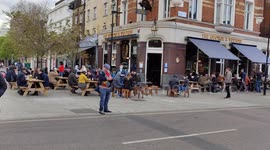 Pubs busy in the snow as they reopen after last UK lockdown