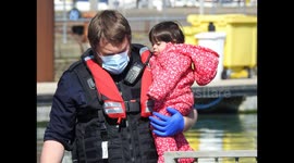 Child brought off of a dinghy in the English channel.safe in the hands of border force at Dover docks