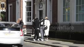 Man helped By Two Friends