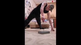 Russian fitness expert performs risky push-ups with screwdriver