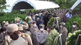 Wild monkeys treated to fruit buffet to mark death of former prince in Thailand