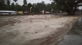 Muddy flash floods gush through village in Philippines after heavy rain