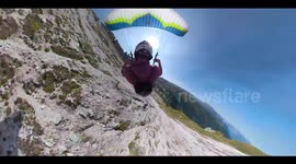 Speedflyer glides dangerously close to ground during mountain descent in Austria