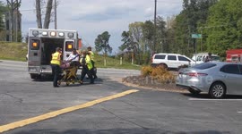 Black woman loaded into ambulance after car wreck