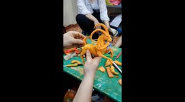 Professional Vietnamese sculptor carves detailed goat out of carrots