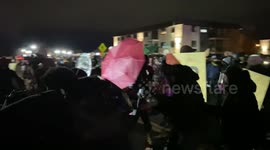 Protestors sing amid civil unrest in Brooklyn Center, Minnesota before being relentlessly nailed with police projectiles.