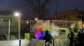 Fireworks, pepper spray, and tears. Protestor emotionally berates the police after taking chemical irritant to the face.