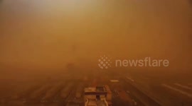 Timelapse of powerful sandstorm gradually shrouding Chinese city