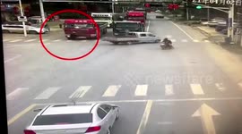 Elderly Chinese man narrowly avoids being run over by truck