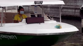 Electric boat service in a Bangkok canal aims to reduce pollution