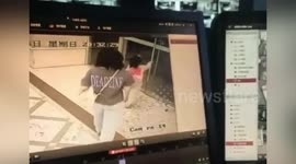 Glass door shatters on little girl as she tries to pull it open in southern China
